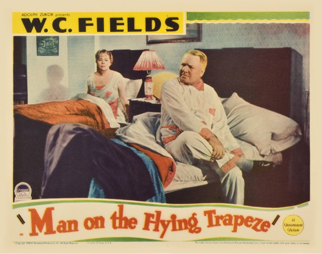 Man on the Flying Trapeze movie poster W.C. Fields rolling up his socks before bed in Man on the Flying Trapeze.