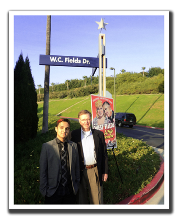 Allen Fields and Austin Fields standing next to W.C. Fields Drive sign post.